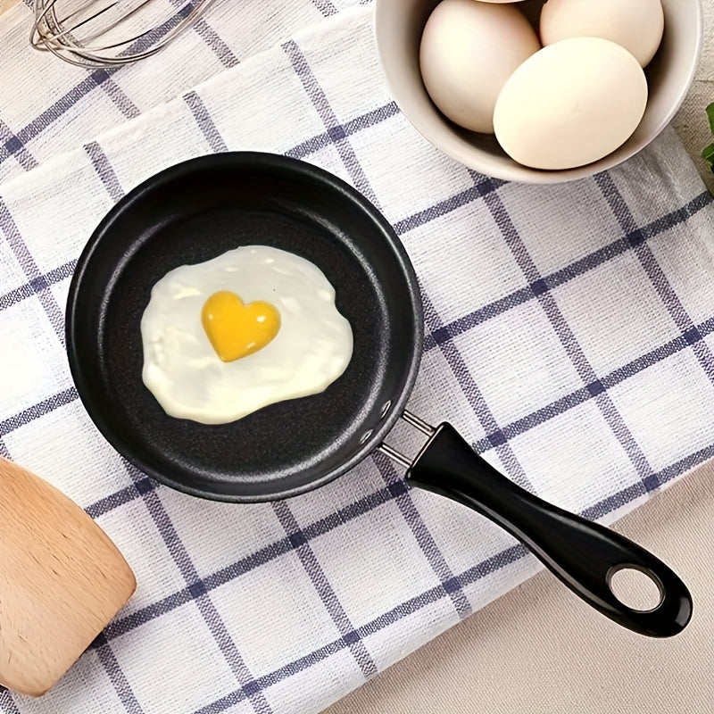 Mini non-stick frying pan, built to last with durable design. Perfect for cooking eggs and vegetables on the go, this portable skillet features a flat bottom for even heat distribution. Easy to clean and maintain, this cookware is thickened and designed