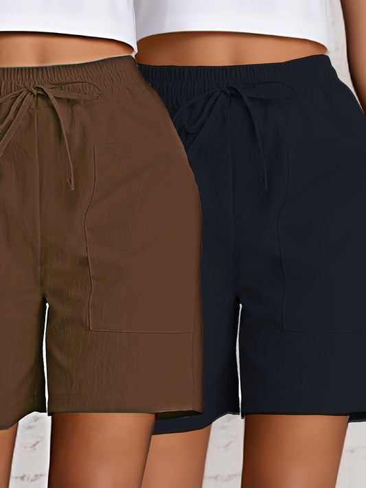 2-Pack of Women's breathable cargo shorts in solid colors. Made of lightweight polyester with dual pockets and drawstring detail. All-season fashion.