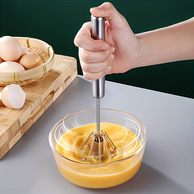 Essential kitchen gadget: Stainless steel whisk and milk frother for baking, eggs, and cream.