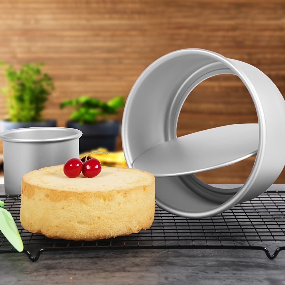 A tiny 2-inch mini aluminum golden round cake mold with removable bottom and thickened anodized base for baking DIY cakes.