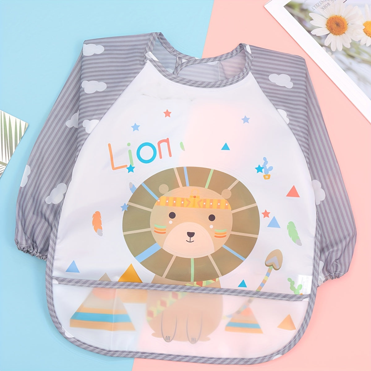 Easily cleanable reverse wear cartoon bib with waterproof long sleeves, suitable for home and travel.