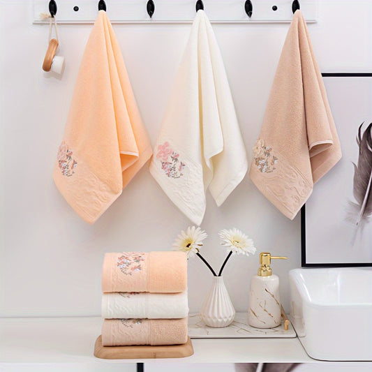 2 Cotton embroidered hand towels with quick-drying, absorbent material for home bathrooms.