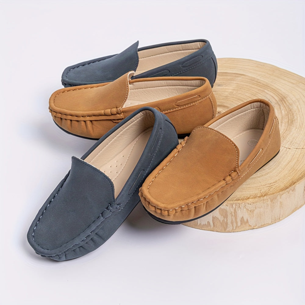 Boys' slip-on loafers in black and brown, suitable for all activities.