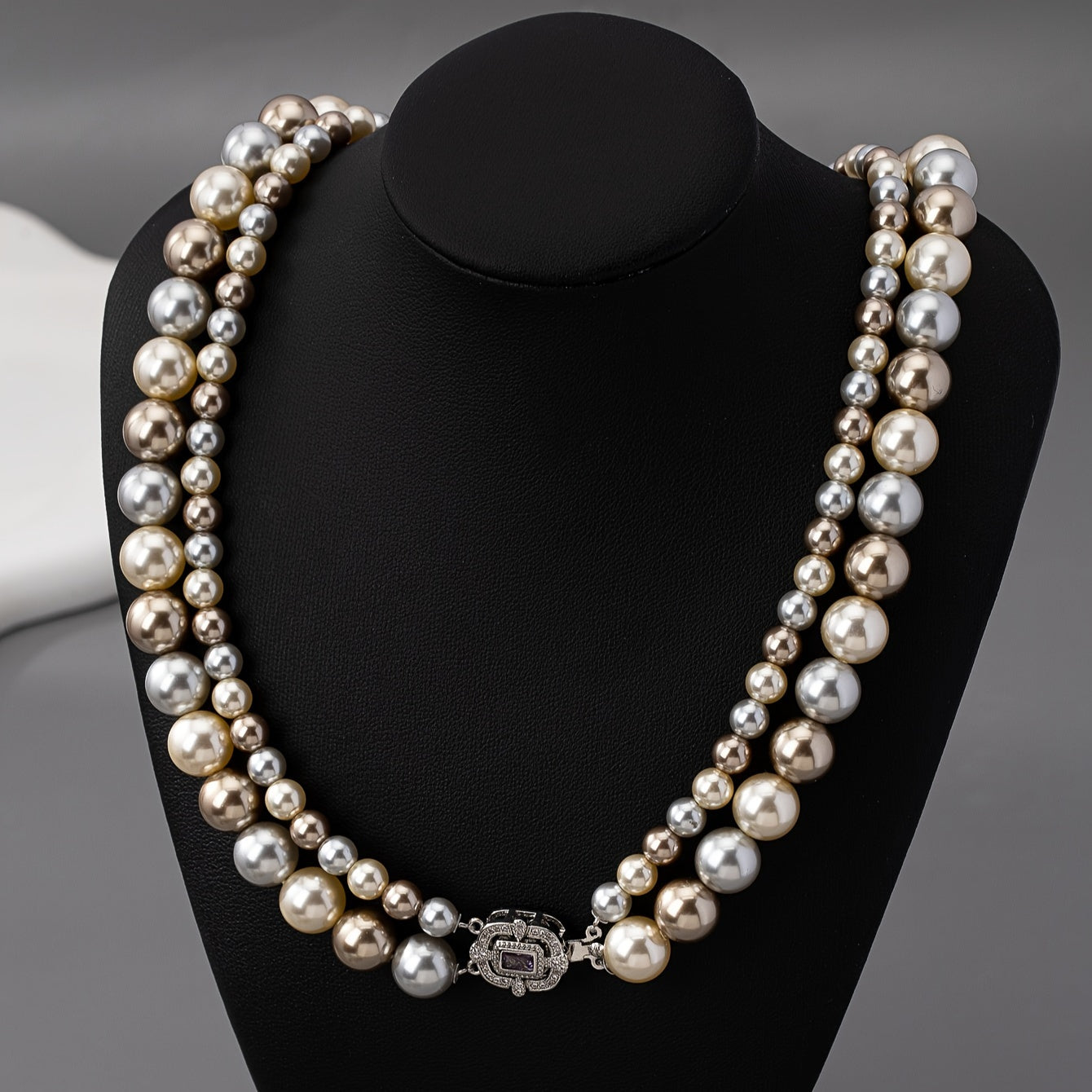 For special occasions and weddings, adorn yourself with our exquisite double-strand pearl necklace featuring 22K golden plating and a zirconia clasp. This elegant piece comes with detachable layered imitation pearls for a timeless and luxurious look.