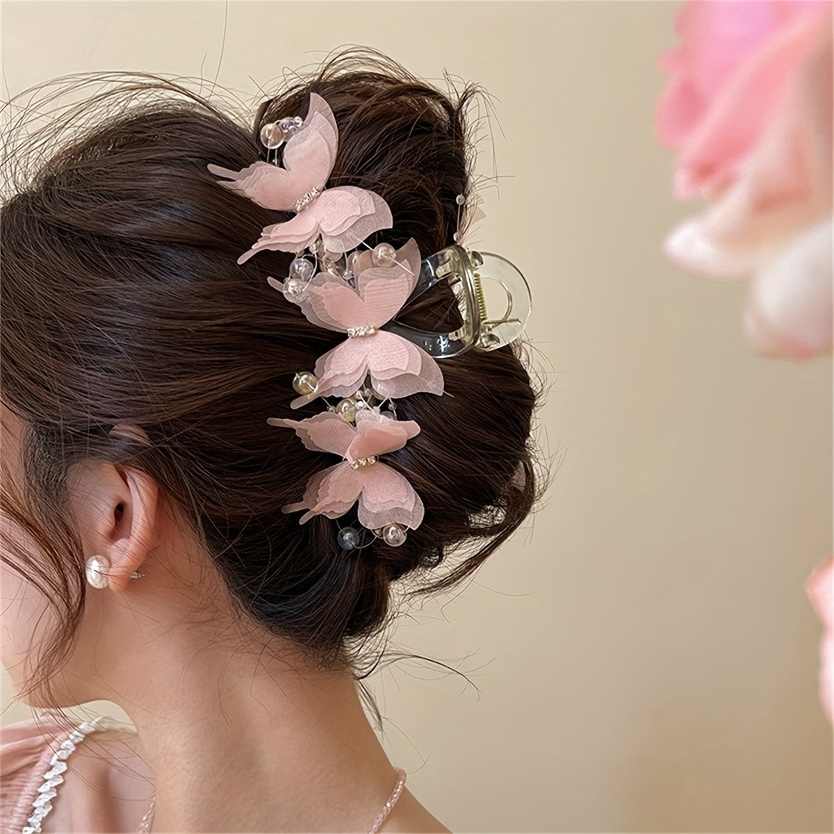 Stylish golden butterfly hair clip with crystal beads - perfect for chic updos & buns.