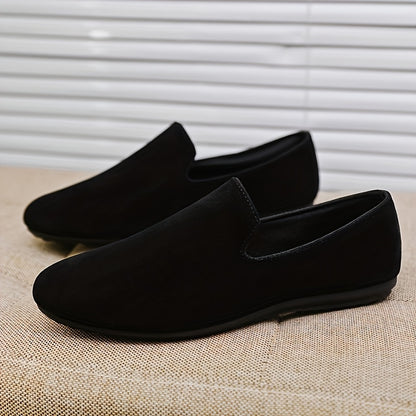 Men's black slip-on loafers with round toe and PVC sole for fashionably casual everyday wear in Spring/Summer 2024.