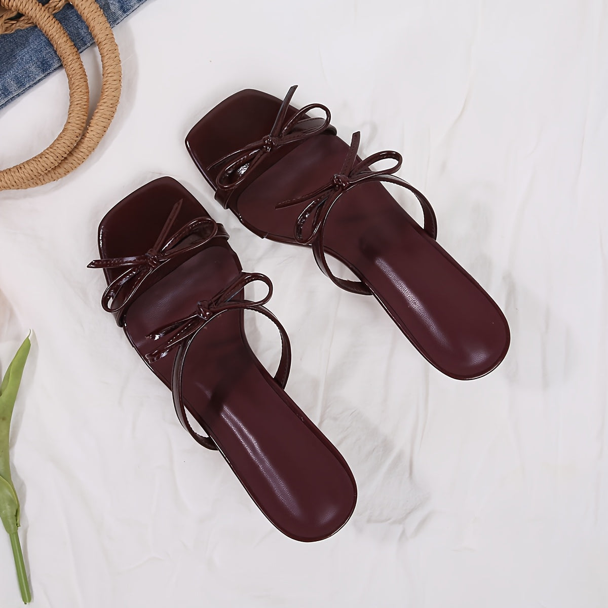 Burgundy kitten heel pumps with French flair, open toe, and bow detail.