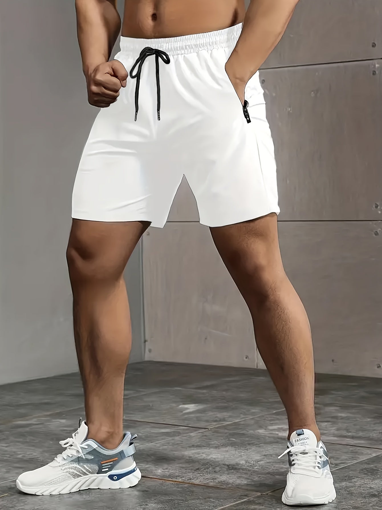 Solid men's shorts with zipper pockets, elastic waist drawstring for summer fitness.