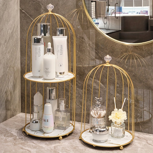 Luxury gold-toned cast iron makeup organizer with cage-shaped bathroom shelf for elegant display of perfumes and skincare products on vanity or countertop.