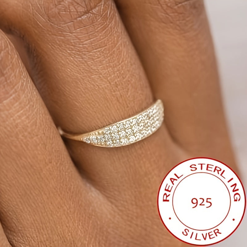 This exquisite ring is made of 925 sterling silver and is elegantly plated with 14k gold. It is adorned with sparkling zirconia stones, representing luxury and sophistication. This high-quality ring is perfect for engagements or weddings, embodying