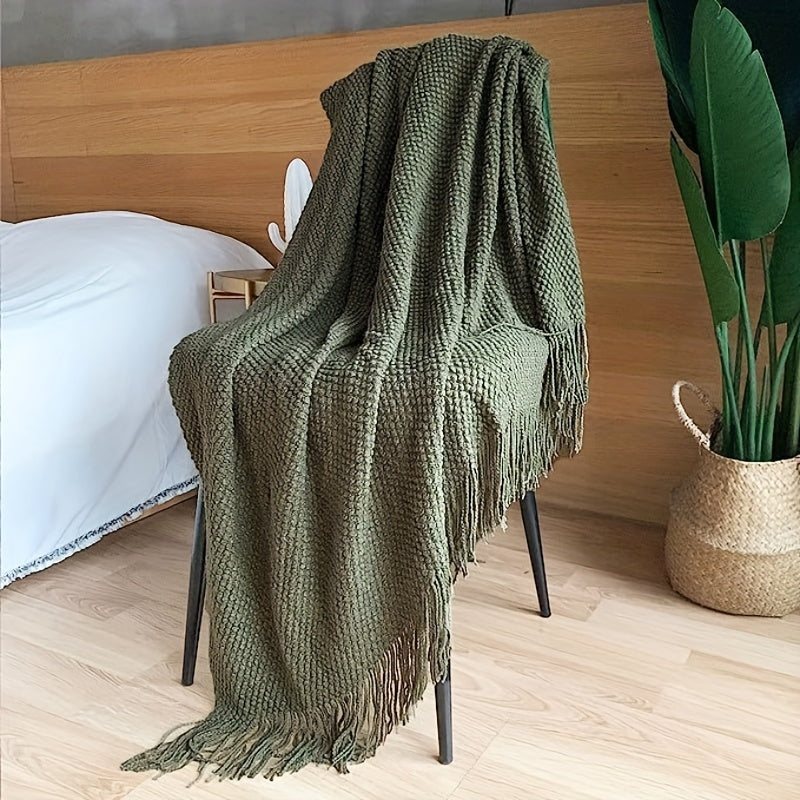 Stay cozy and stylish with this elegant knit throw blanket, featuring tassels for added flair. Made of lightweight acrylic with a bubble textured design, this blanket offers all-season comfort. Perfect for use on the couch, bed, or as home decor, as well