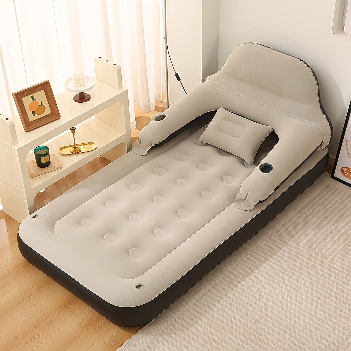 Air mattress with headboard, blow-up sofa bed, for indoor and outdoor use.