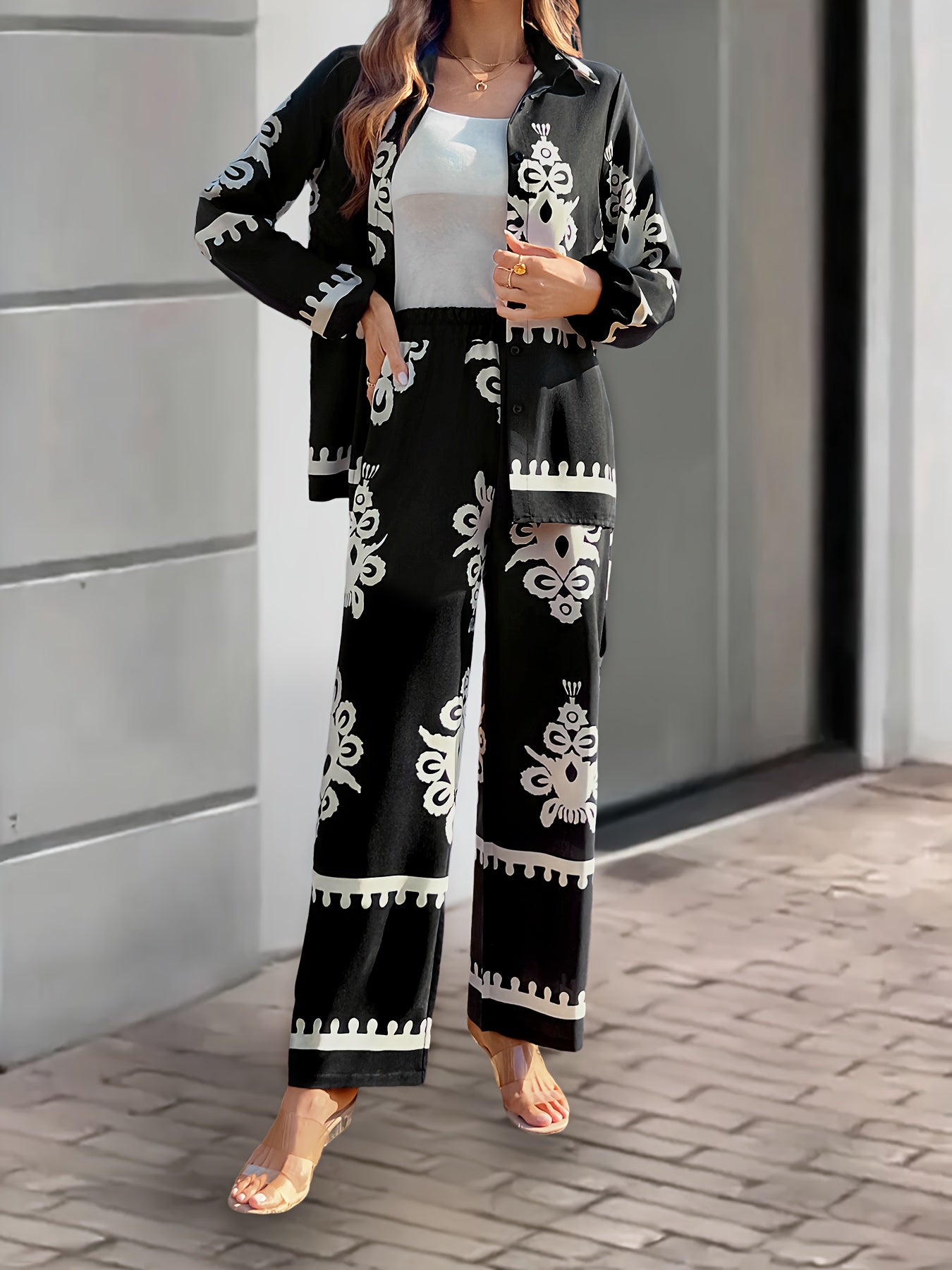 Women's 2-piece casual suit made of 100% polyester, featuring a long sleeve top with button front and pants with plant pattern. Loose fit with cardigan collar and regular sleeves, suitable