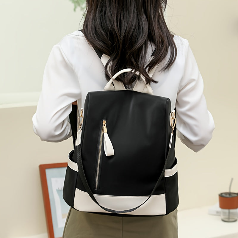 Stylish anti-theft backpack for women, made of lightweight, durable nylon with laptop compartment. Comes in pink, blue, and black.