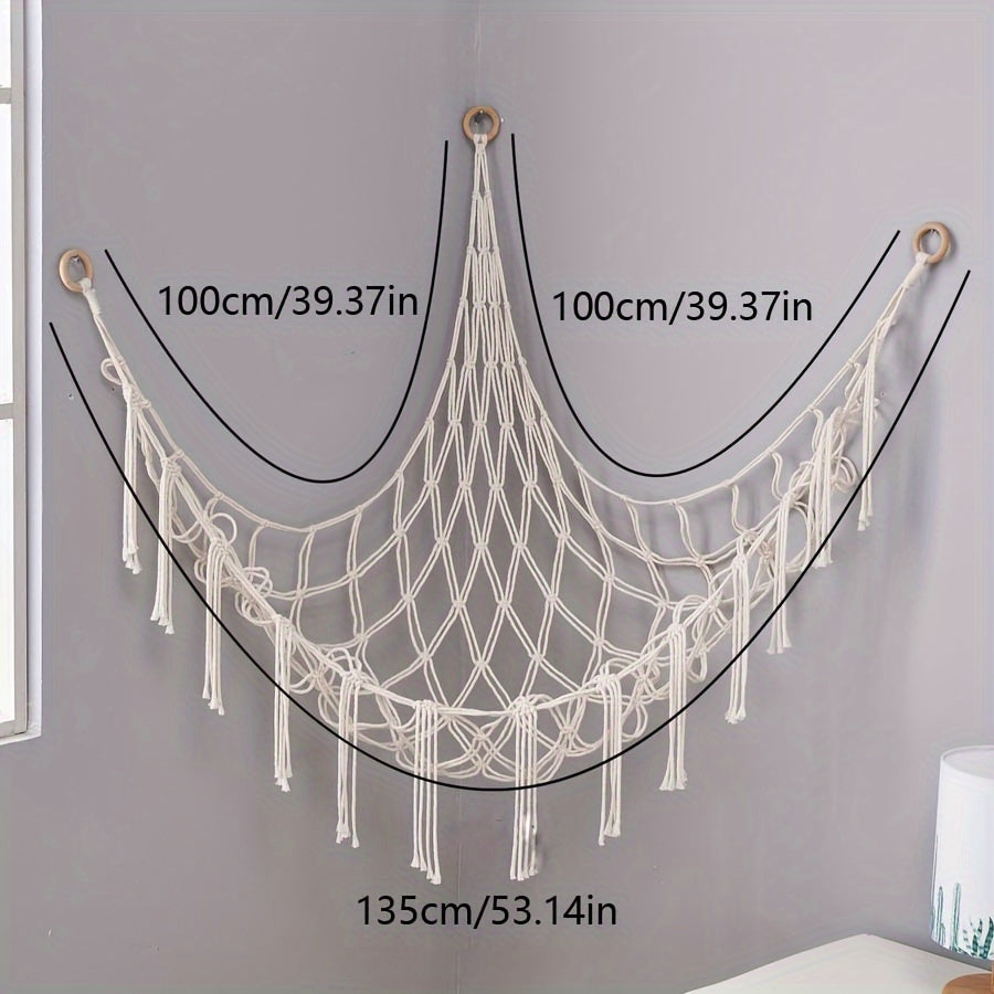 Handmade macrame wall storage net with hooks for toys and plushies. Versatile decor for living room, bedroom, or playroom.