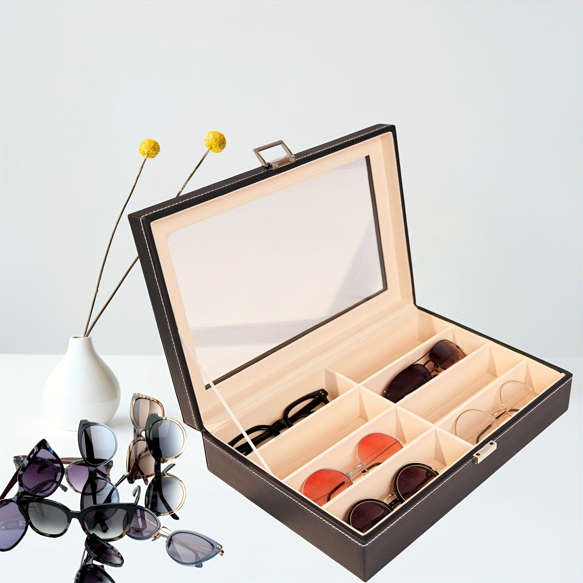 Organize your sunglasses in style with this retro PU leather eyewear display case featuring 8 slots and stitch detail. The glass lid allows you to easily see and access your sunglasses while keeping them protected. Store your glasses in this sleek and