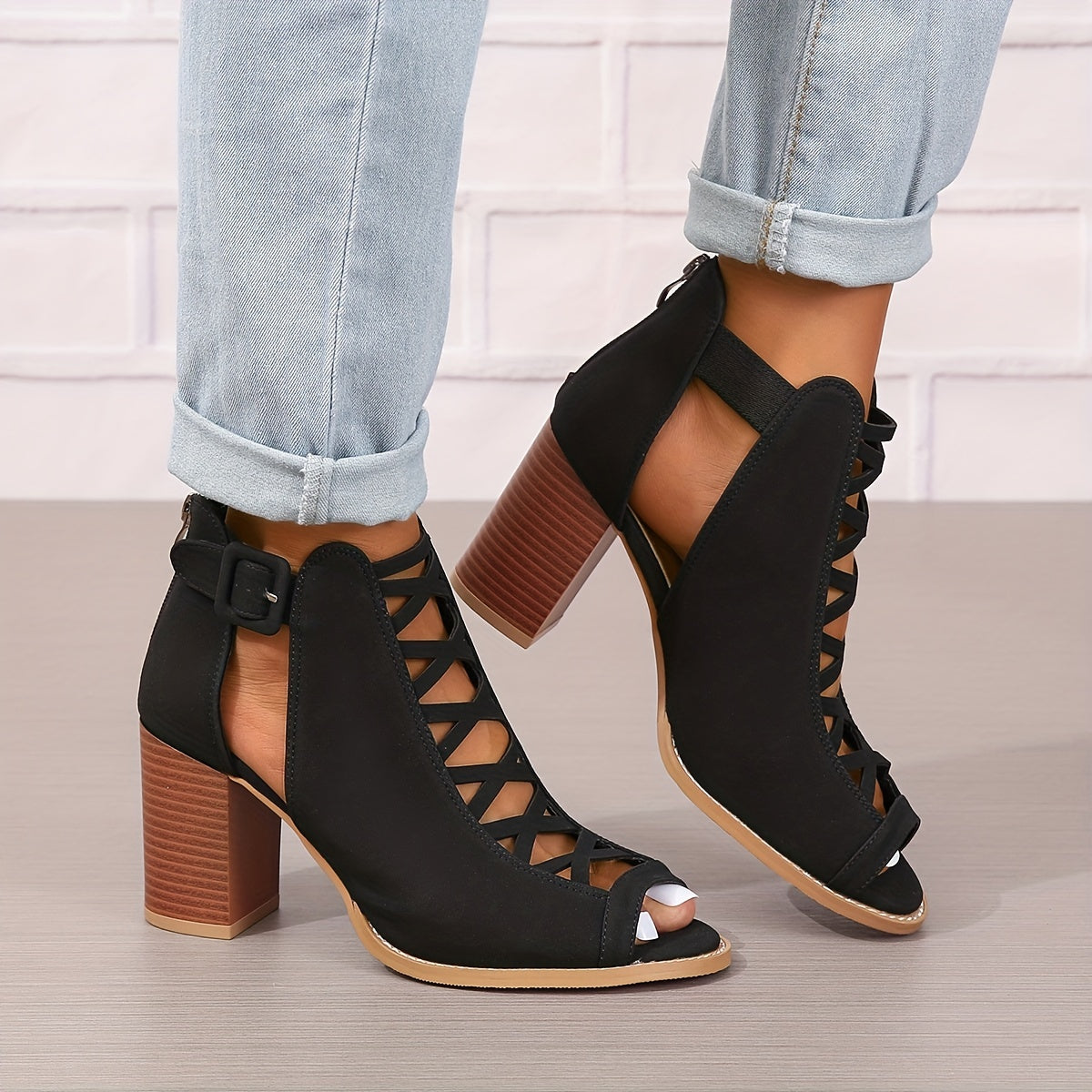 Women's brown faux leather ankle boots with elegant design including peep toe, chunky heel, crisscross straps, and buckle closure. Comfortable summer pumps with rubber sole.