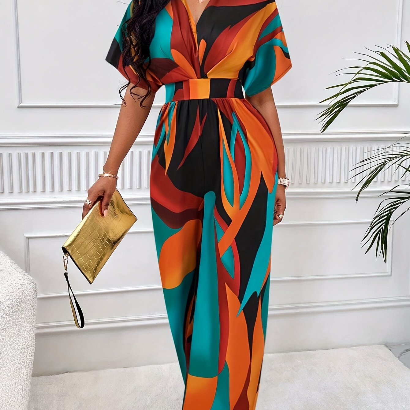 Women's geometric print jumpsuit with batwing sleeves, tie waist, v-neck, machine washable polyester, suitable for all seasons.