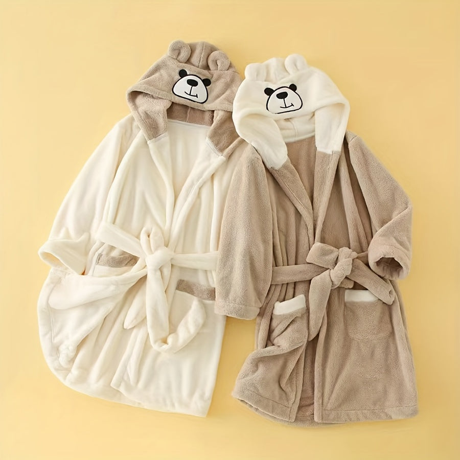 Soft coral fleece bathrobe for kids with hood, cartoon bear design, and thick warmth. Machine washable and perfect for all seasons.