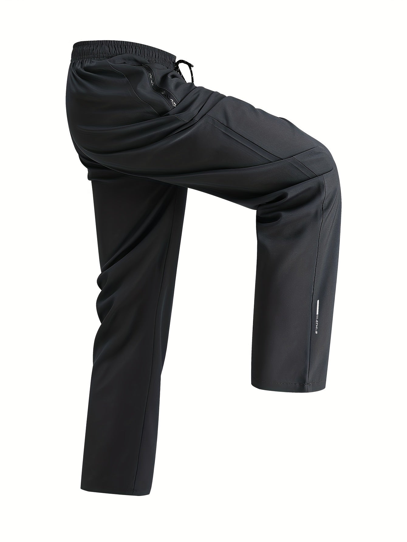 Men's loose-fit polyester pants, breathable and quick-drying, perfect for running and fitness. Features regular length, zipper detail, and printed pattern, ideal for spring and fall.