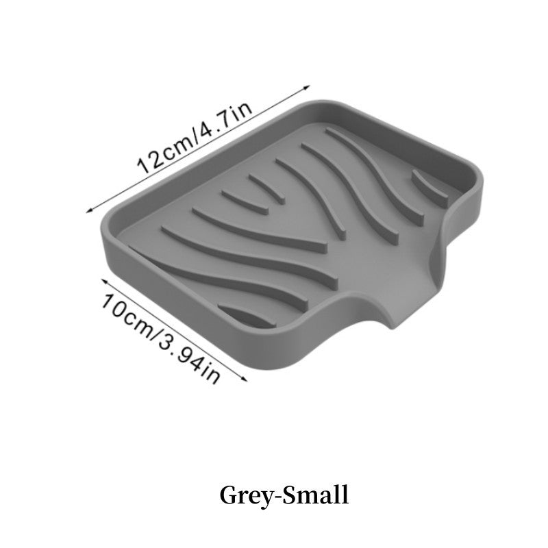 Silicone soap dish with self-draining design for countertop or sink storage in bathroom.