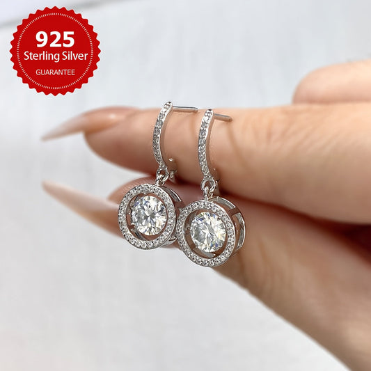 Luxurious 1CT Moissanite Hoop Earrings in 925 Sterling Silver, perfect for weddings and special occasions. These Round Dangle Earrings make a great Valentine's Day gift for women, adding a touch of elegance and luxury to any outfit. Show your loved one