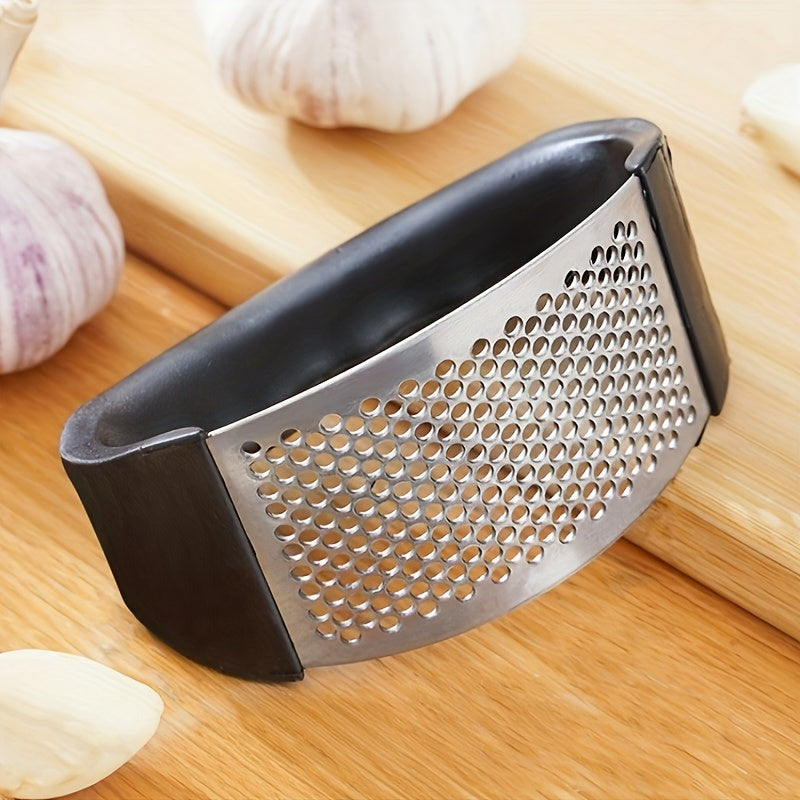 Stainless steel garlic press for easy crushing, ideal for outdoor recreation, travel, camping, and small living spaces.