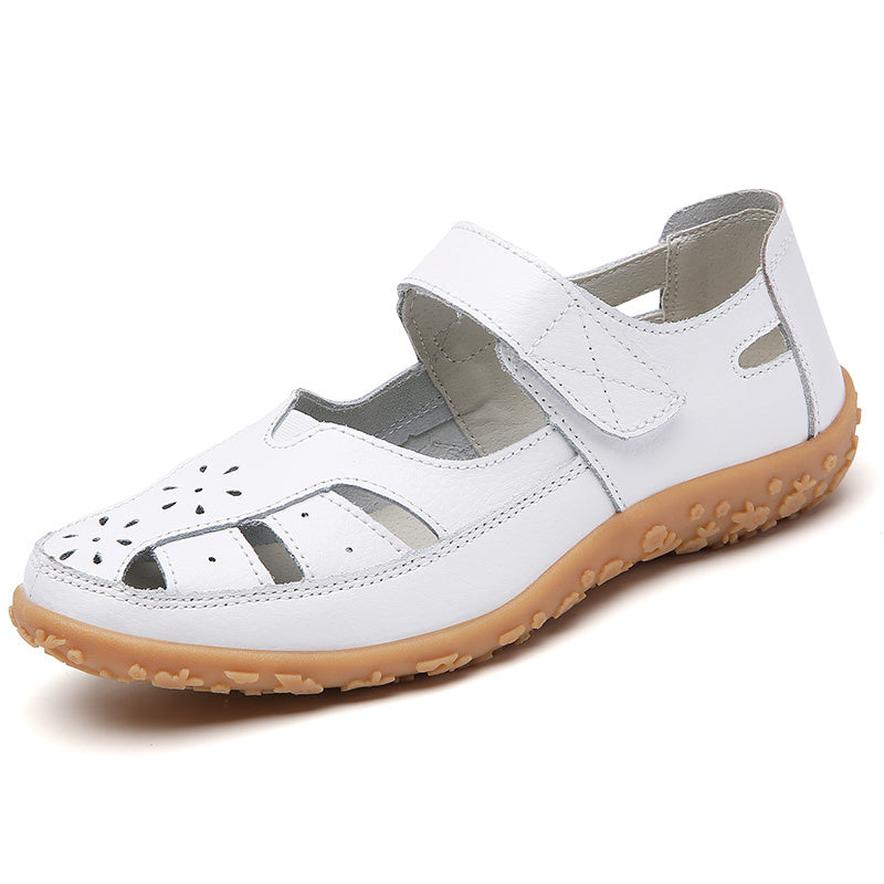 Cut-out flat sandals for women with soft soles and hook & loop closures, ideal for casual walking with their non-slip closed-toe design.