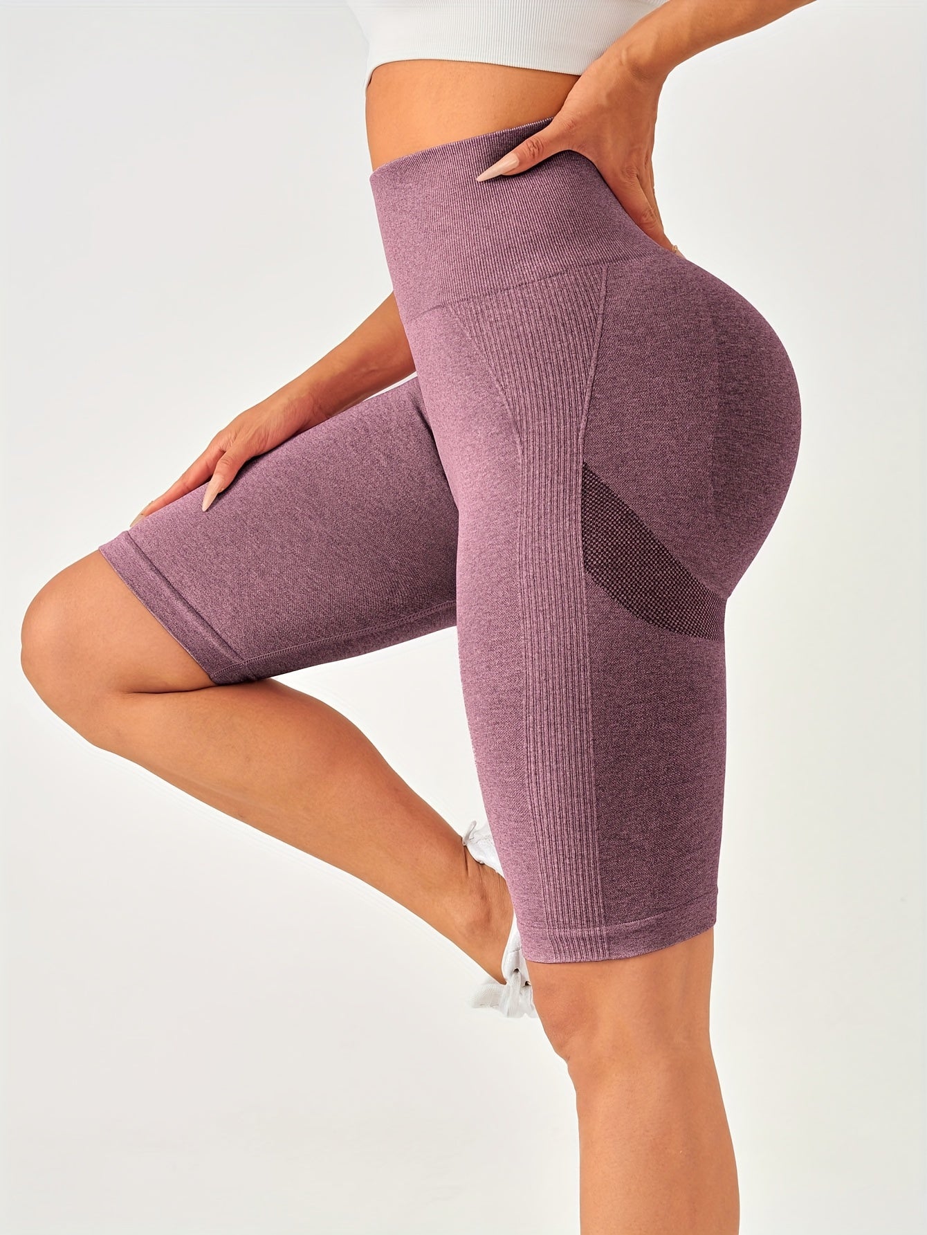 Solid color knitted yoga fitness pants for women with high waist, hip lift, and tight belly.