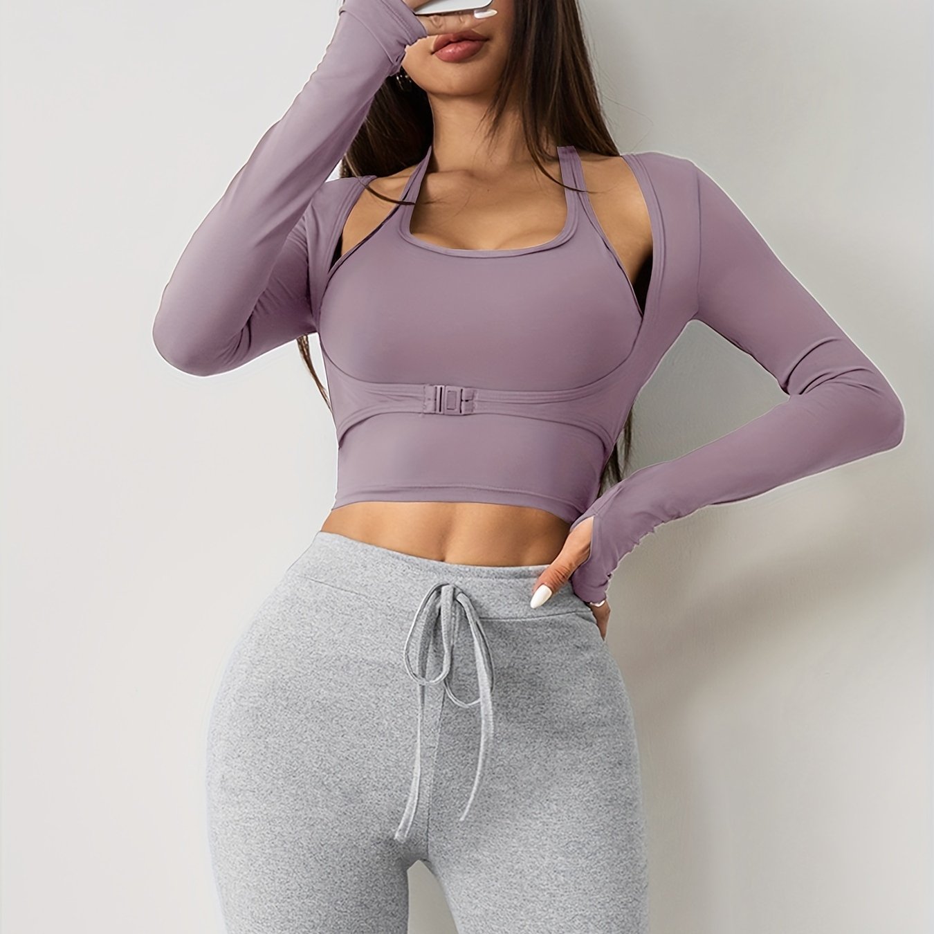 Women's long sleeve yoga top with built-in bra, seamless sports crop top for fall and winter seasons.