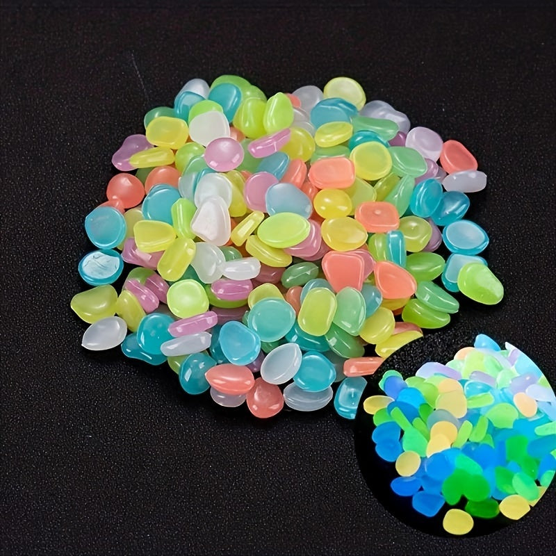 100 pieces of glowing decorative rocks made from fish-safe ABS material for aquariums, gardens, bonsai plants, and outdoor decor.