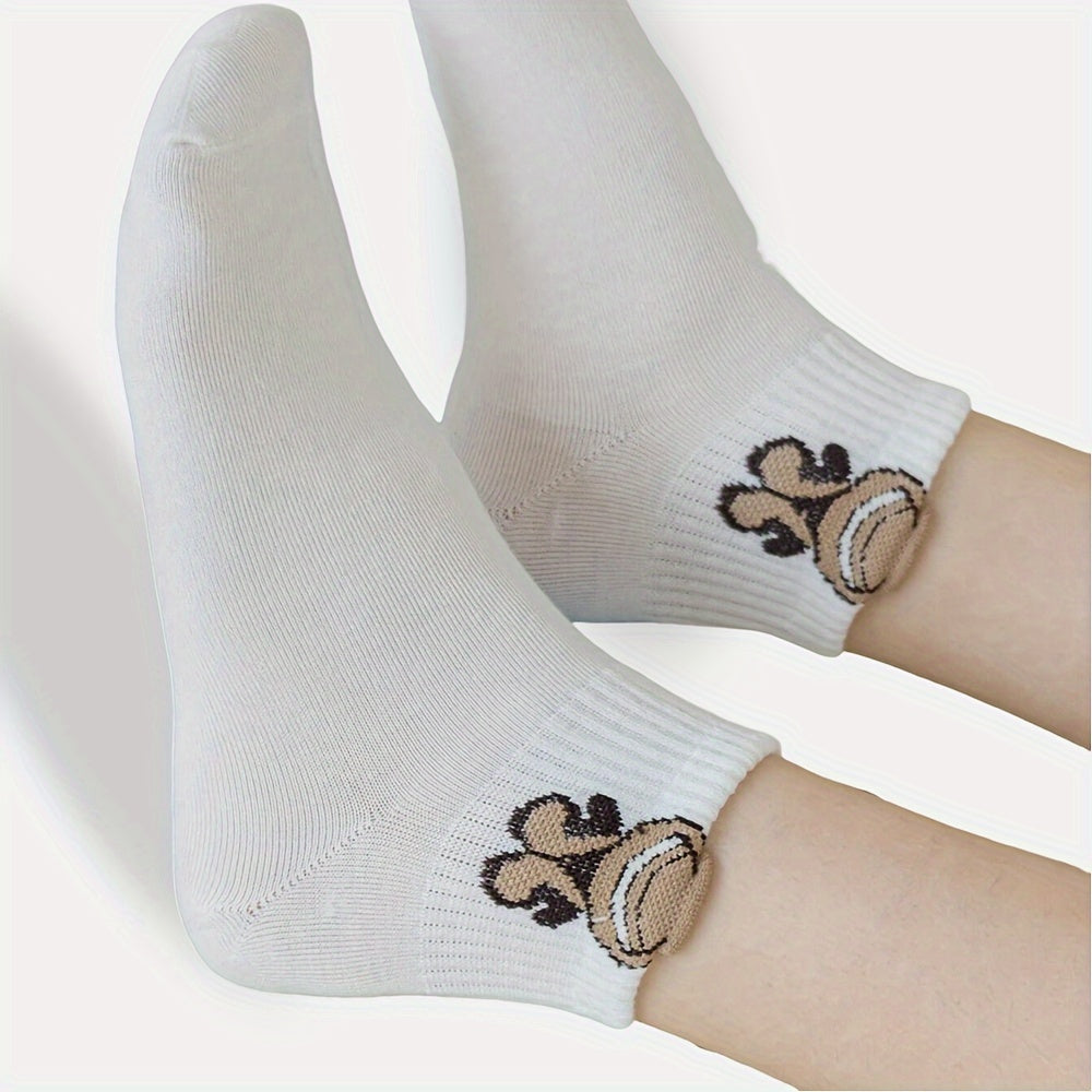 5 pairs of cute and soft white cartoon print short socks for women, made of breathable material.