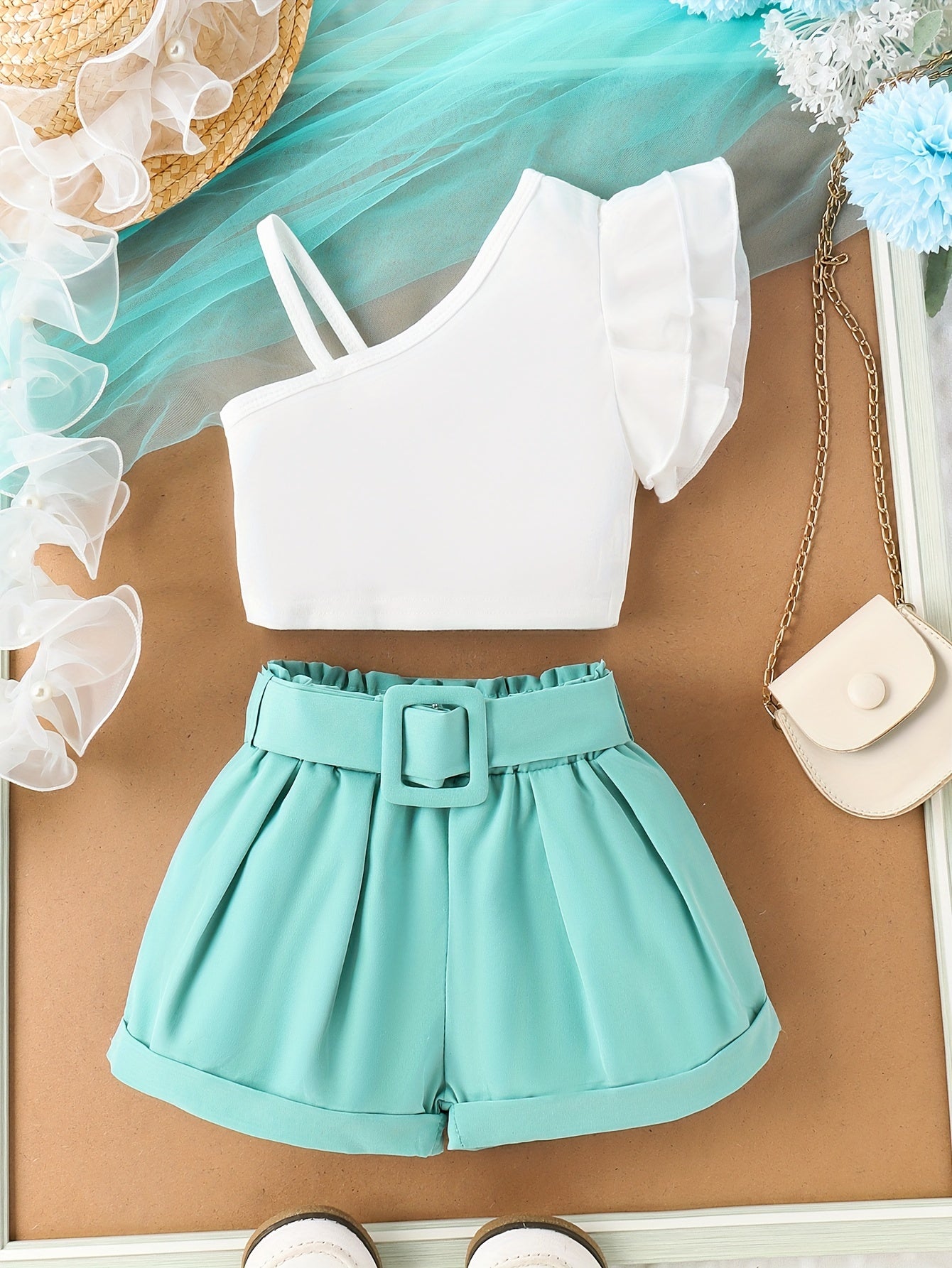 Girls' sleeveless top with flutter trim and elastic waist shorts set for summer party.