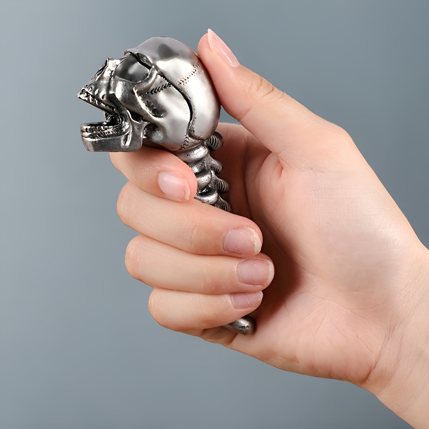 Skull-shaped metal bottle opener for beer and juice, perfect for home and restaurant use.