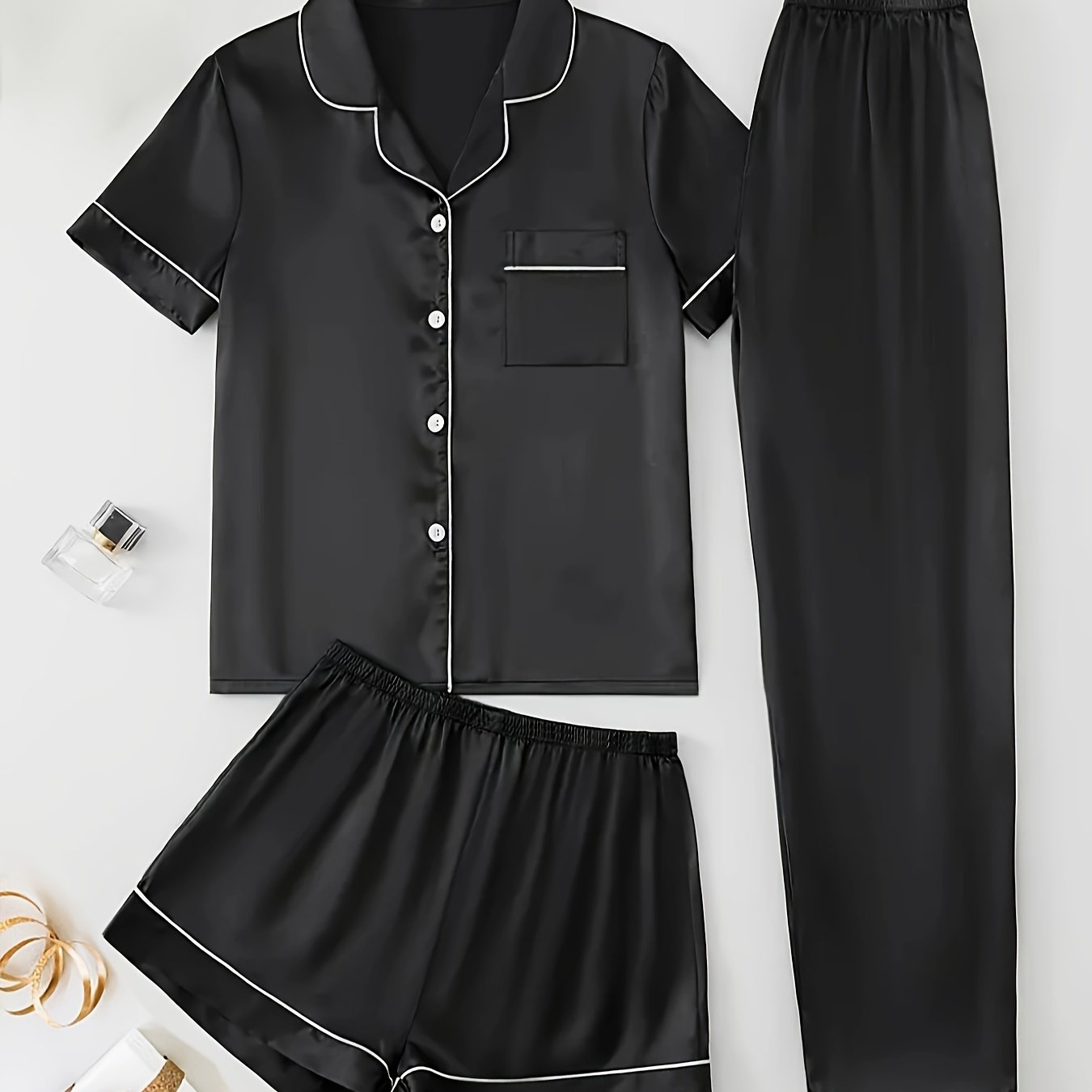 3-piece summer satin pajama set for women featuring collared shirt, long pants, and shorts. Made of 95% polyester and 5% elastane. Available in sizes S-XL.