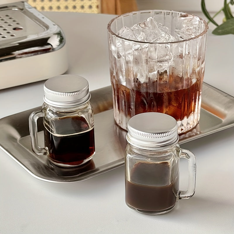 Mini Mason jar shot glass with lid, leakproof glass, ideal for home, parties, and bars. Perfect for beverages such as coffee, milk, juice, honey, and jam. Hand wash only.