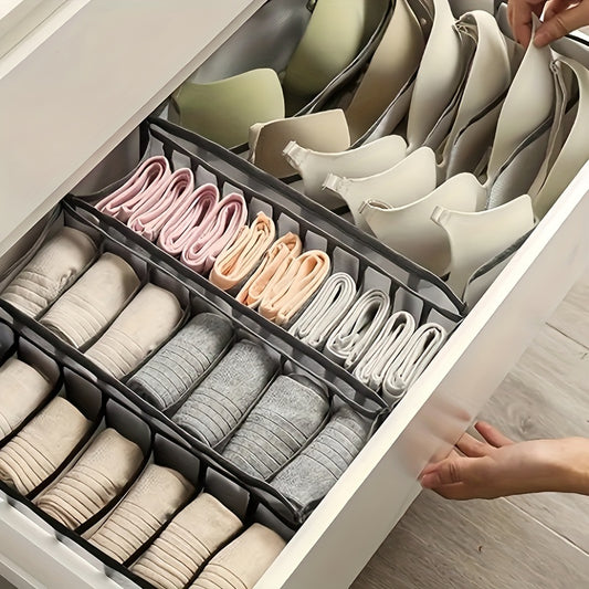 Fabric organizer boxes for underwear and socks in drawers.