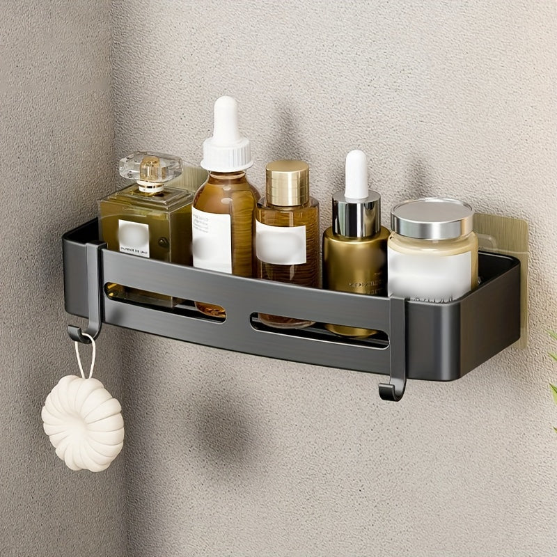 Wall-mounted bathroom storage rack for shampoo, shower gel, and cosmetics; made of space aluminum with no need for drilling.