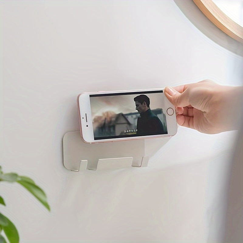 Wall-mounted mobile phone holder made of carbon steel, self-adhesive charging bracket with contemporary style. No punch installation, perfect for kitchen use and live streaming.