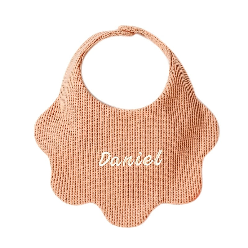 Customize your baby's style with our Personalized Drool Bibs. These bibs feature custom embroidery, an adjustable snap closure, and soft absorbent knit fabric. They make the perfect gift for a baby shower or holiday. Suitable for babies aged 0-3 years