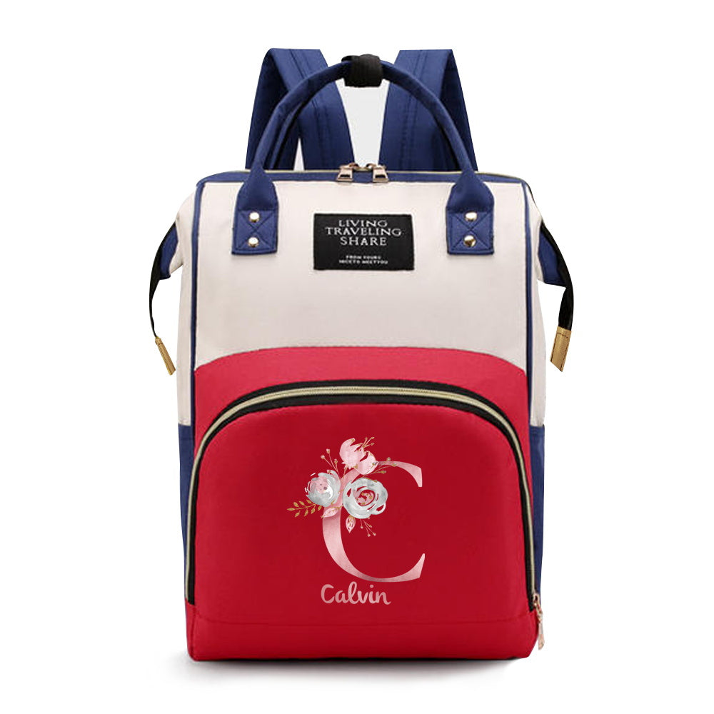 Personalized Mommy Backpack made of durable Oxford cloth with ample storage space for diapers and other essentials. Features customizable initials and name, as well as convenient bottle pockets. Perfect for nursing mothers on-the-go, with options for A-Z