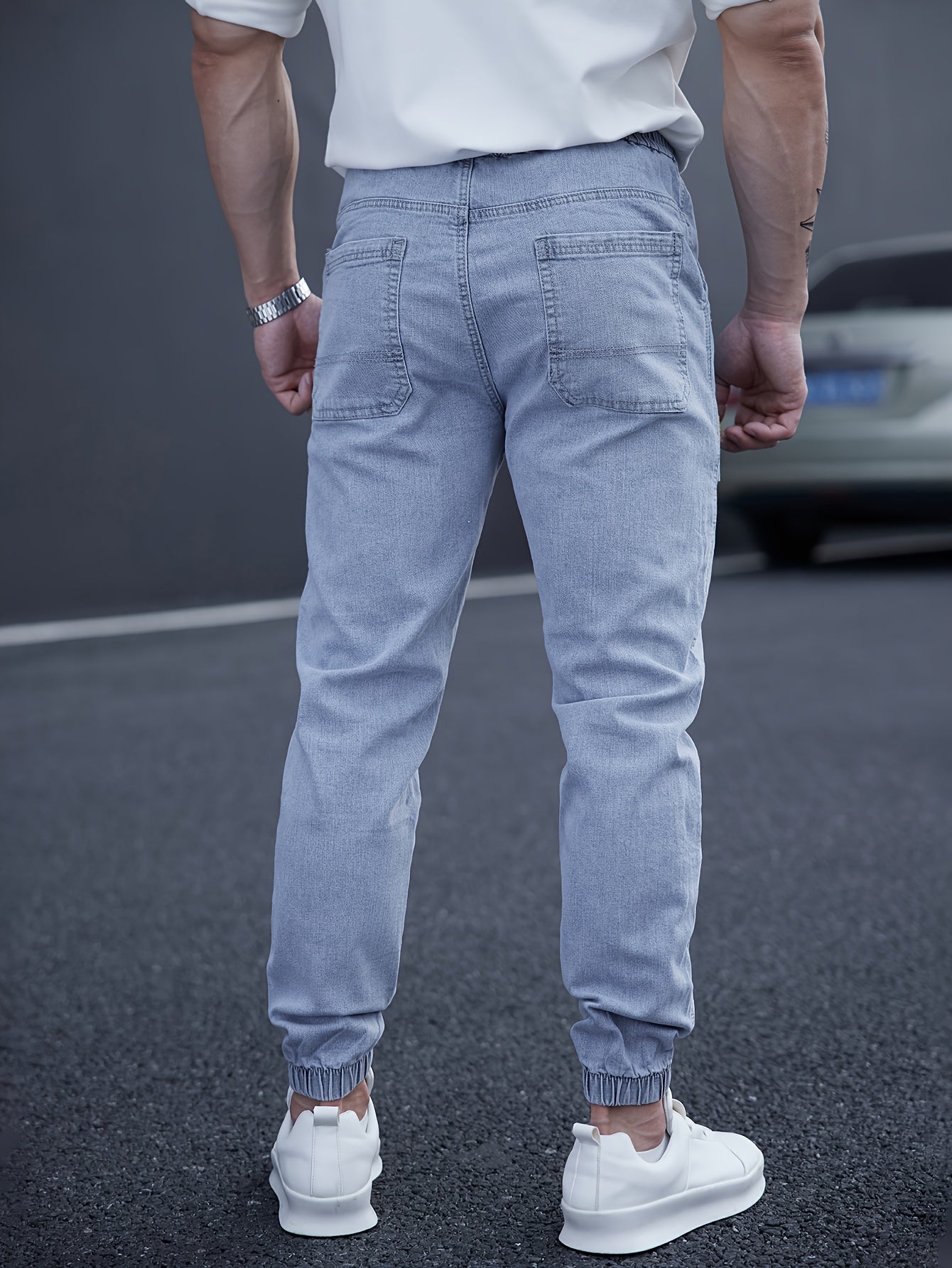 Trendy men's tapered jeans with waist drawstring