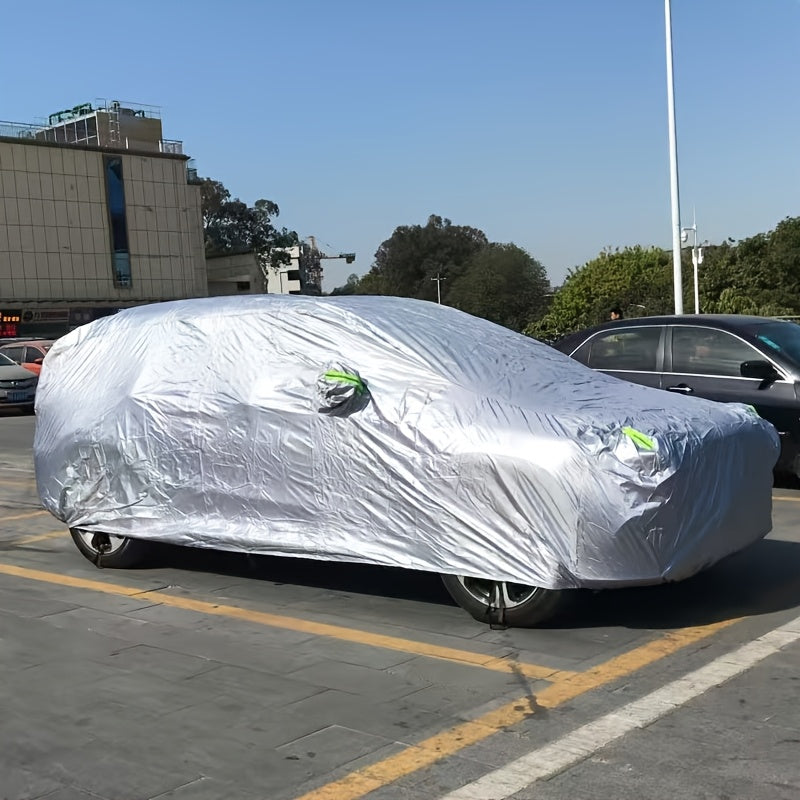 Car cover with UV and dust protection, suitable for cars, pickups, SUVs, and hatchbacks. Features reflective strip for added protection. Suitable for outdoor use.