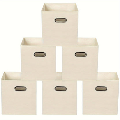 6 pieces of foldable fabric storage bins with handles are available in classic cube designs for organizing your home, bedroom, or office. Choose from black, blue, or cream options.