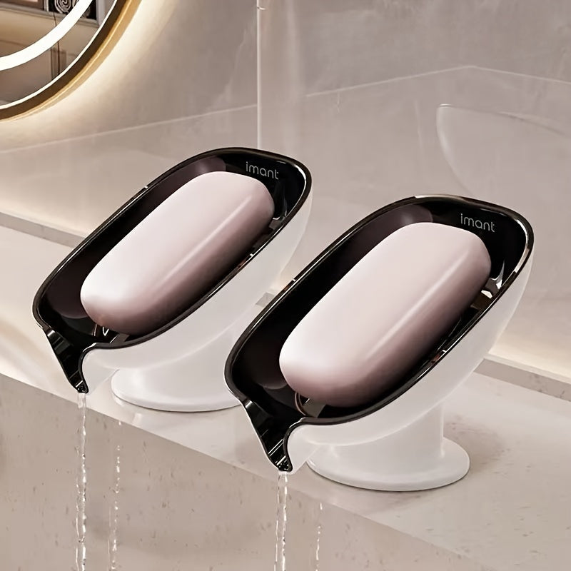 Durable plastic oval soap dish with an elegant, self-draining design for bathroom use.