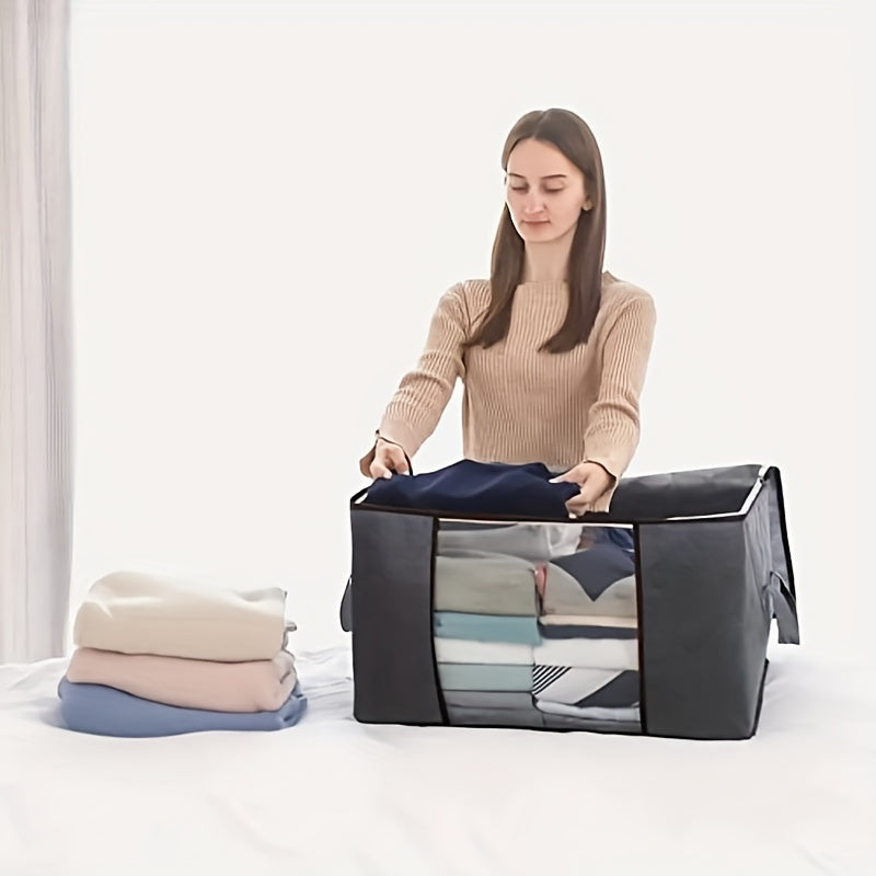 Three 90L storage bags with reinforced handles for organizing clothing, blankets, toys, and bedding in a bedroom wardrobe.