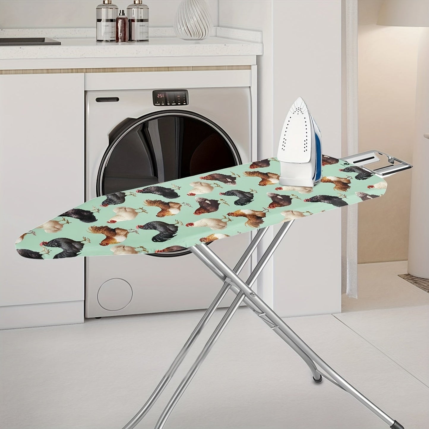 One piece of adorably designed ironing station cover featuring a cute farm rooster pattern. It is suitable for a standard ironing station measuring 38.1cm by 137.16cm. This cover is burn-resistant, stain-resistant, and easy to install. It serves as a