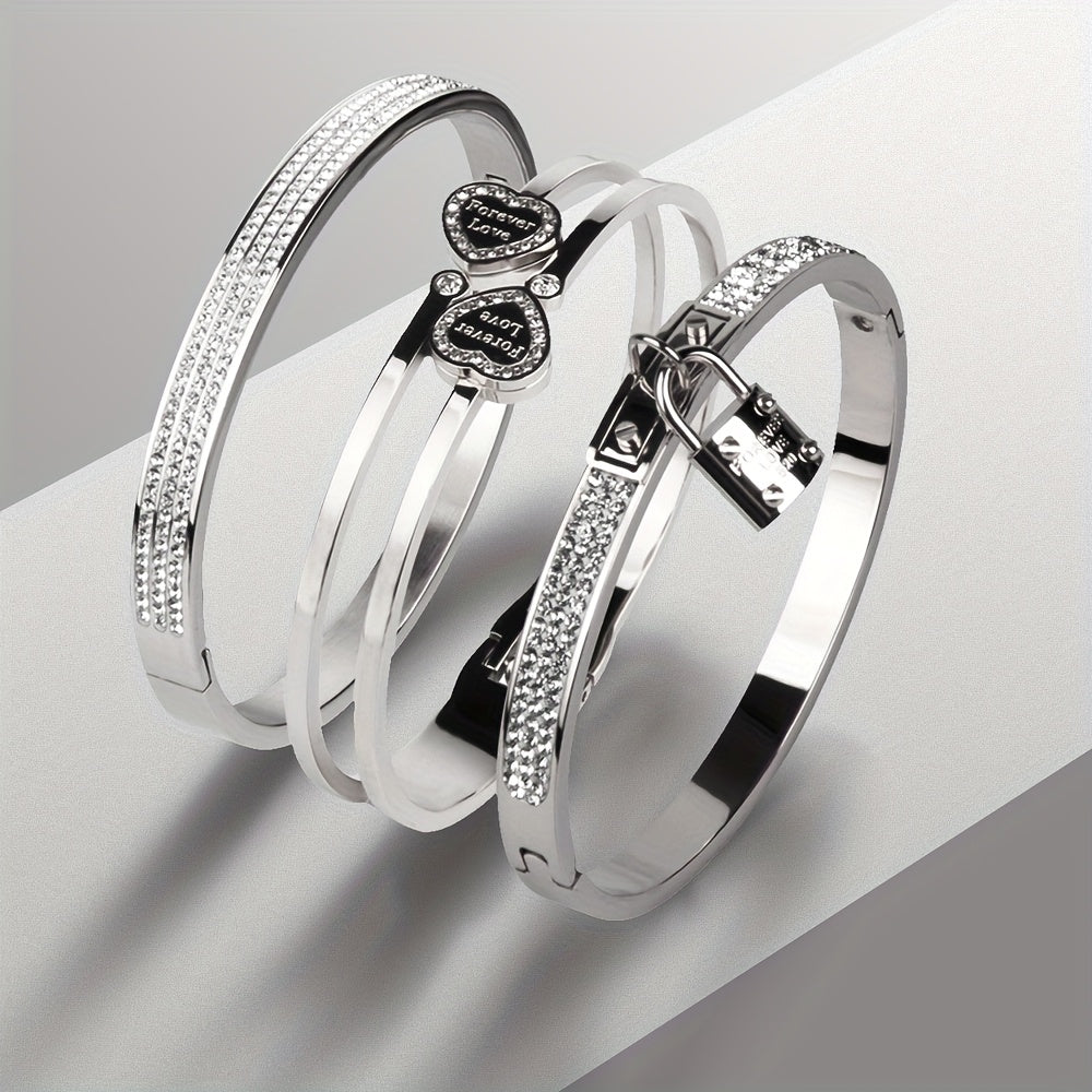 Stylish set of 3 stainless steel bracelets for women, plated in 18K gold with a heart-shaped pendant adorned with sparkling synthetic zirconia. The perfect luxury gift for weddings, parties, and Christmas, suitable for all seasons.