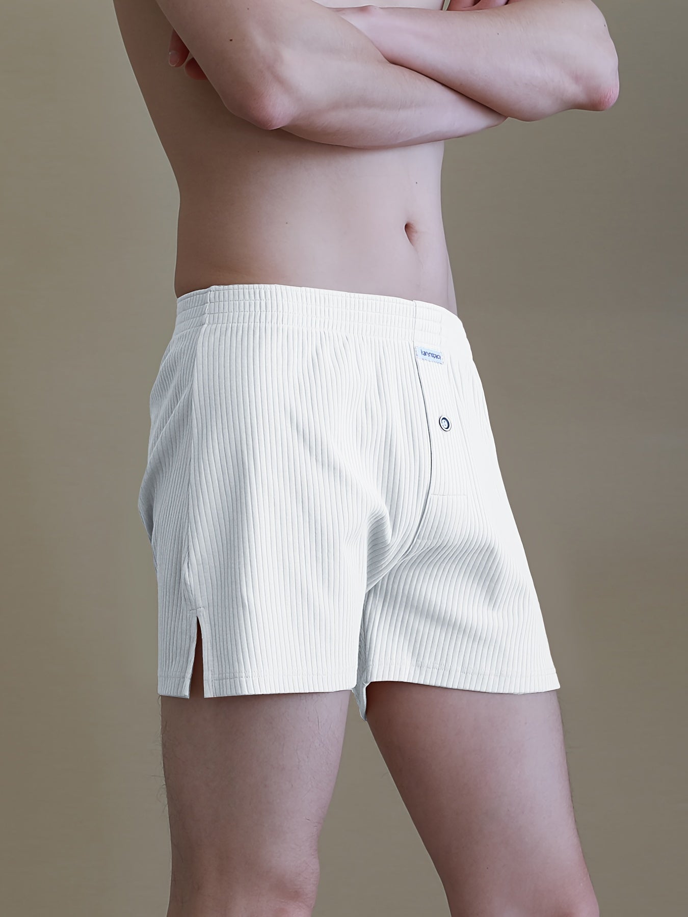 Cotton boxer shorts with button fly, loose fit and breathable for comfortable sleep and home wear.