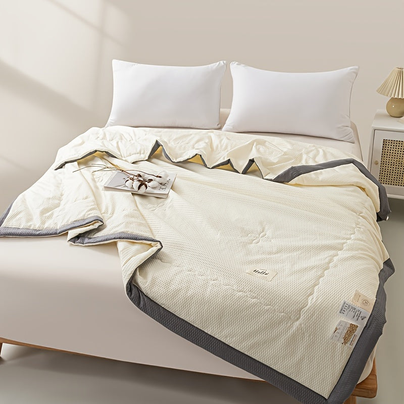 Ultra-soft lightweight summer quilt with cooling bean paste design for bedroom and guest room comfort, machine washable.